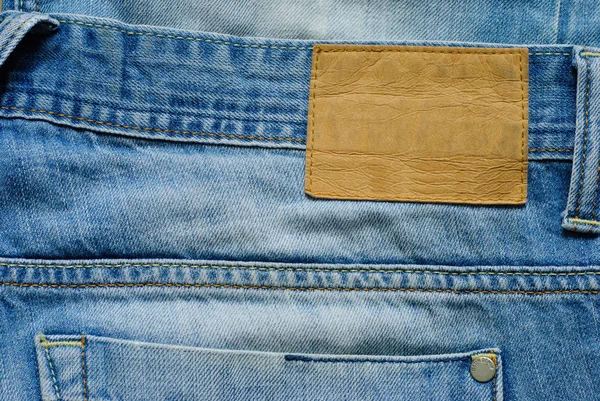 Vecchio jeans blu denim wirh etichetta vuota — Foto Stock