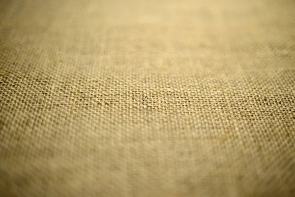 Vintage textured background of coarse burlap, soft focus — стоковое фото