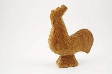 traditional wooden toy cock on a white 