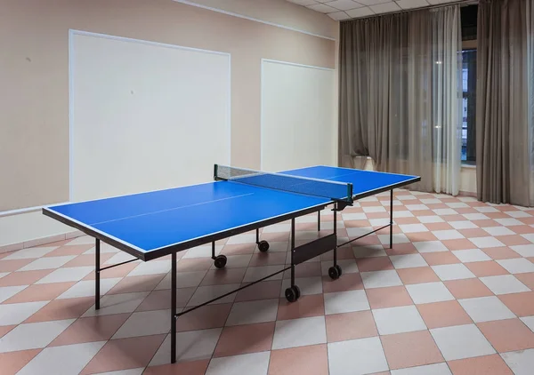 Ping-pong tennis table with Paddles on the floor — Stock Photo, Image