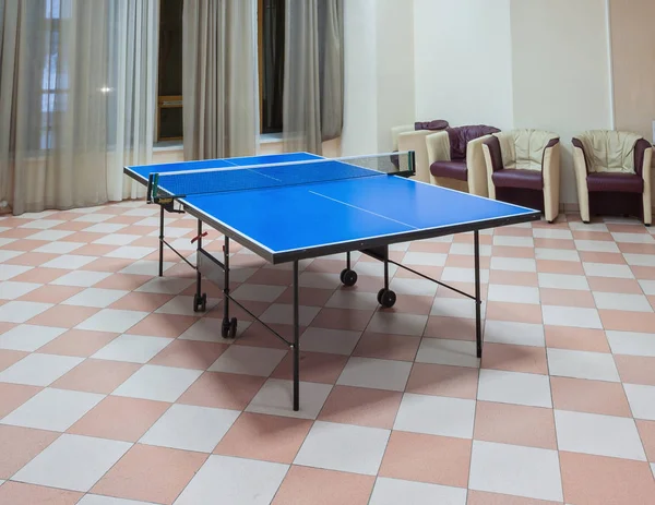 Ping-pong tennis table with Paddles on the floor — Stock Photo, Image