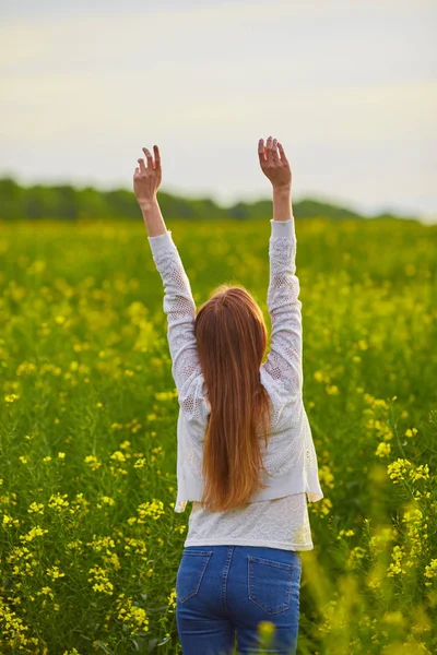 Girl at yellow rape seed meadow — Stock Photo, Image