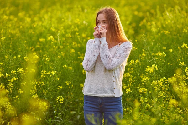 Pollen allergy, girl sneezing