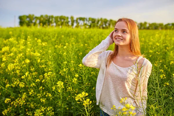Girl at yellow rape seed meadow — Stock Photo, Image
