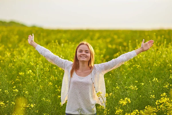 Girl at yellow rape seed meadow Royalty Free Stock Images