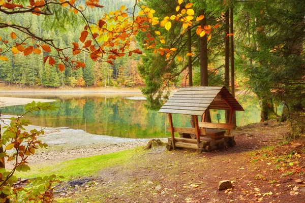 Lake in a forest with a gazebo and small pier for pleasure pedal