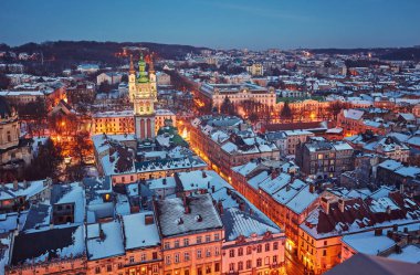 Scenic winter night snowy aerial view of the Old Town architecture clipart