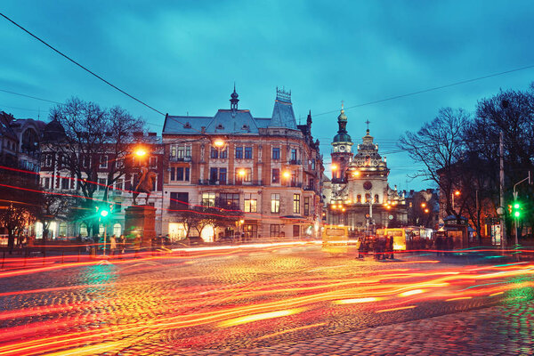 city night street paving stone bench