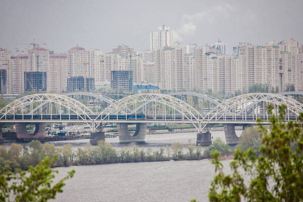 Aerial top view of Paton bridge and Dnieper river from above, city of Kiev