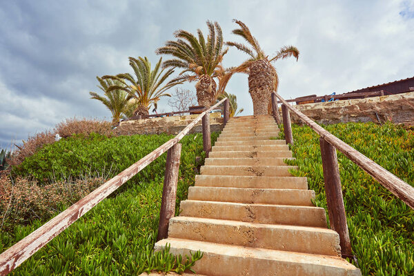 Wooden path down to the beach and ocean.