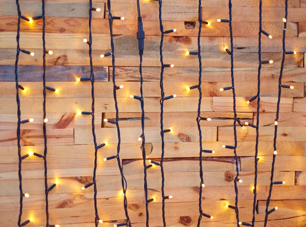 Luz de Natal no fundo de madeira — Fotografia de Stock