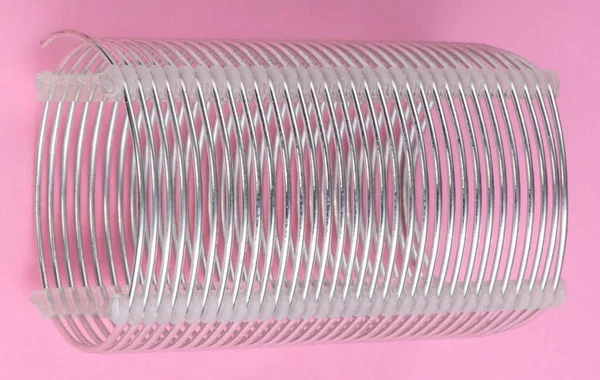 Radio coil on pink background — Stock Photo, Image