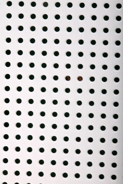 Plastic backround with holes — Stock Photo, Image