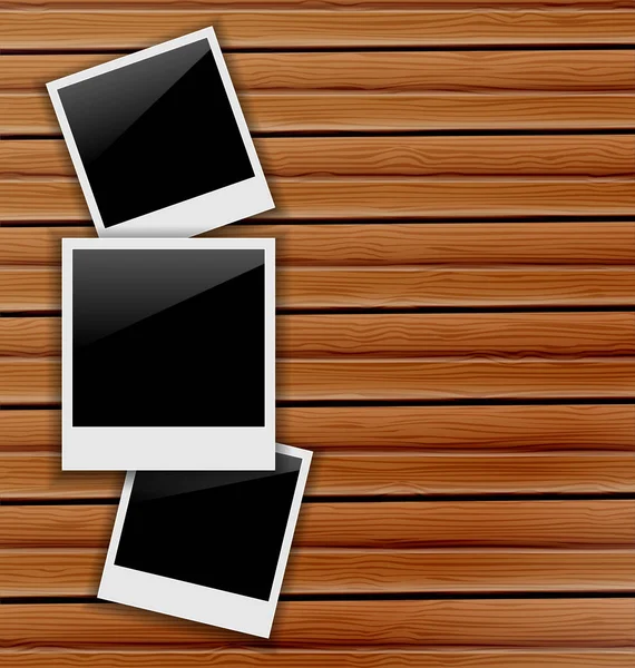 三个空白的相框，木制背景 — 图库照片