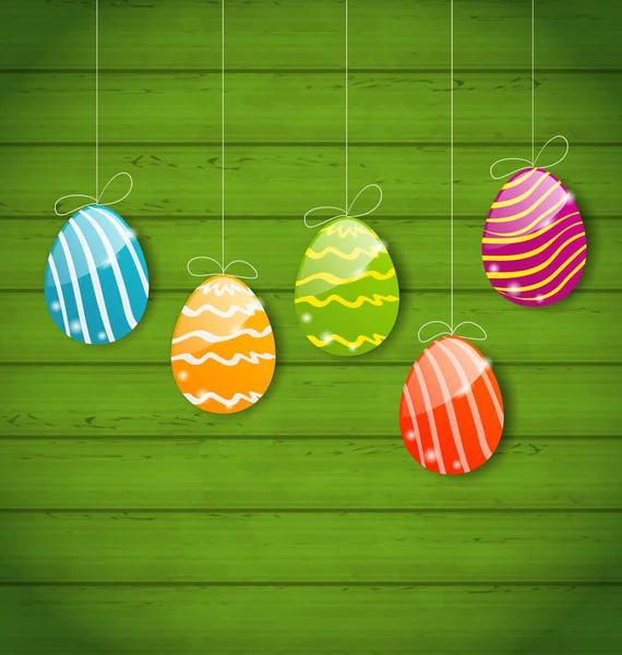 Huevos de Pascua coloridos en textura de madera — Foto de Stock