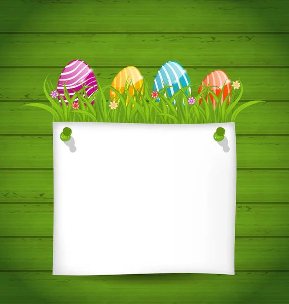 Easter colorful eggs in green grass with empty paper card for y — Stock Photo, Image