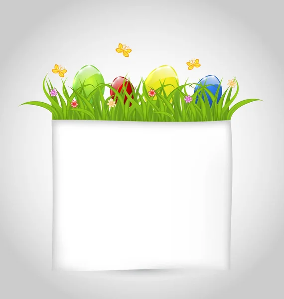 Easter colorful eggs in green grass with empty paper for your te — Stock Photo, Image