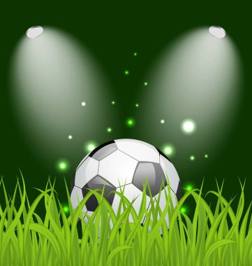 Futbol topu ile ışık yeşil çimenlerin üzerinde