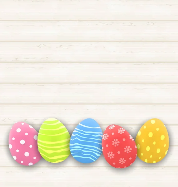 Páscoa ovos coloridos na textura de madeira — Fotografia de Stock