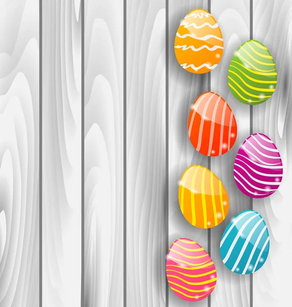 Easter glossy colorful eggs on grey wooden texture — Stock Photo, Image