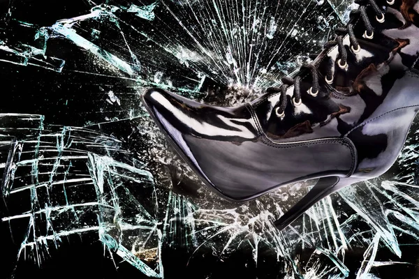 Stomping throught a glass window. — Stock Photo, Image