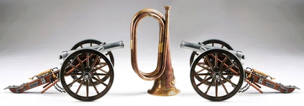 Old Cannons and Brass Bugle. — Stock Photo, Image