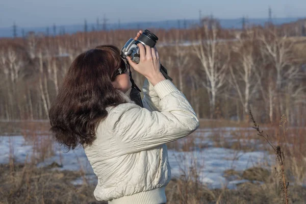 Girl with a camera — Stock Photo, Image