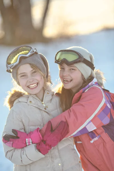 Friends laughing at the ski slope