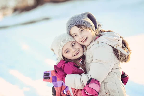 Two young girls having fun on a winter day — Stock Photo, Image