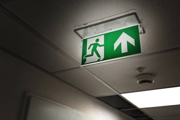 Emergency exit at night in office — Stock Photo, Image