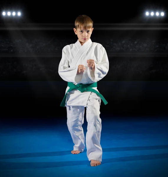 Boy martial arts fighter in sports hall — Stock Photo, Image