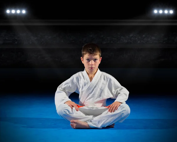 Boy martial arts fighter in sports hall — Stock Photo, Image
