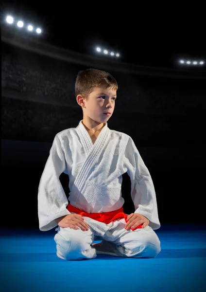 Boy martial arts fighter in sports hall — Stock Photo, Image