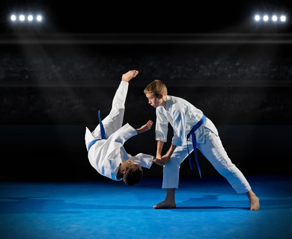 Boys martial arts fighters in sports hall — Stock Photo, Image