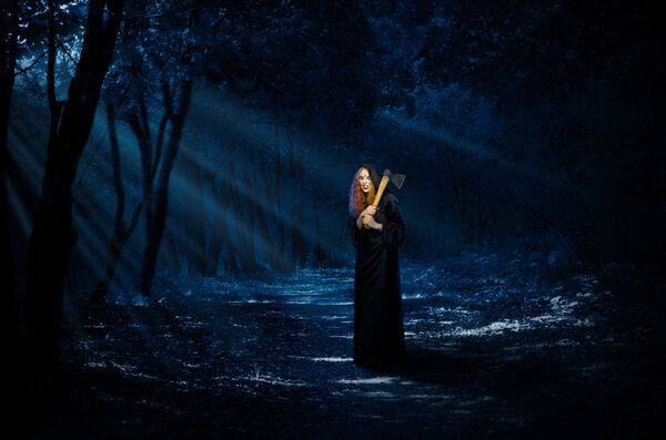 Scary witch in night forest