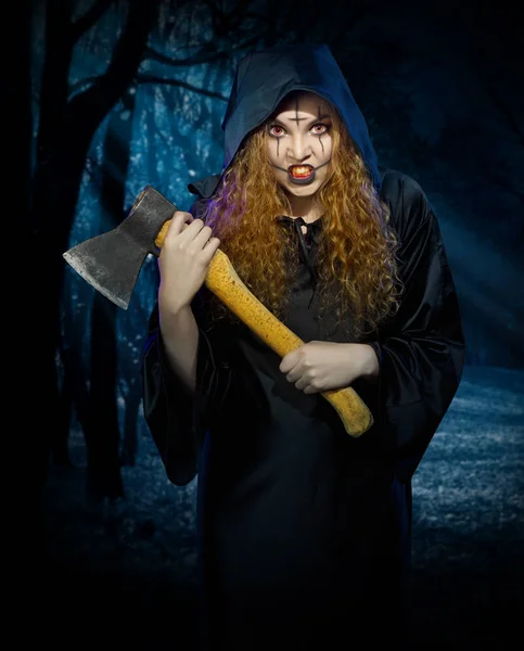 Scary witch in night forest — Stock Photo, Image