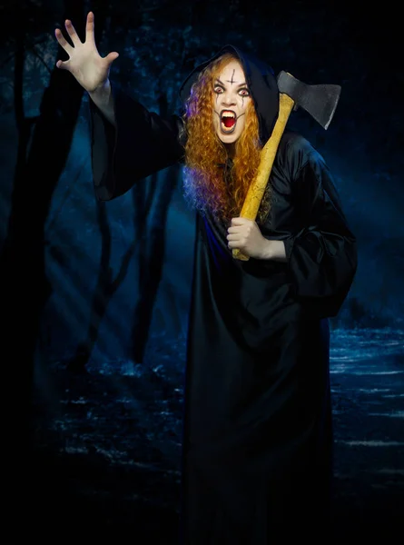 Scary witch in night forest — Stock Photo, Image