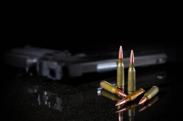 Ammunition cartridges on black — Stock Photo, Image