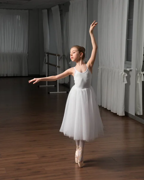 Little girl classic ballet dancer in studio