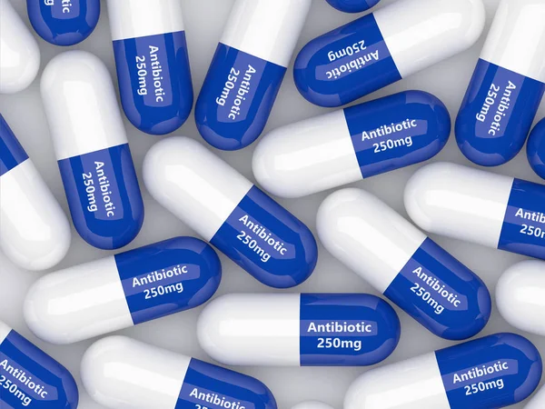 3d representación de píldoras antibióticas que yacen sobre la mesa blanca — Foto de Stock