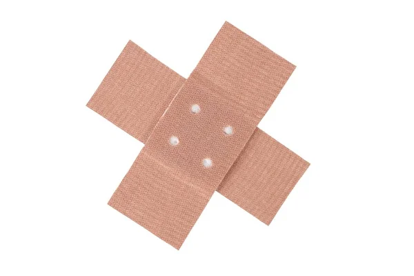 Cruzamento de bandagem adesiva no branco — Fotografia de Stock