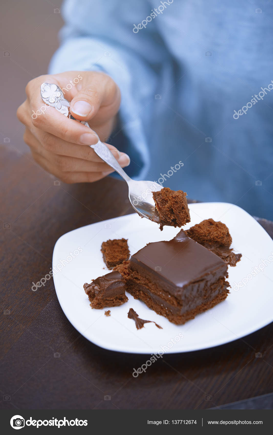 Woman eating chocolate cake Stock Photo by ©DepositNovic 137712674