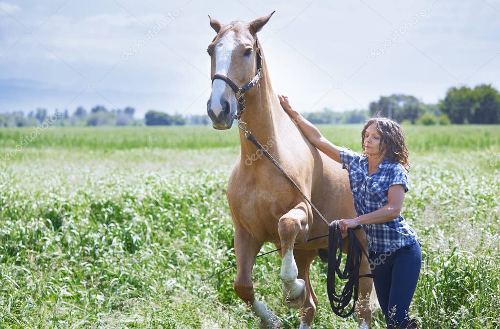 Woman training her horse
