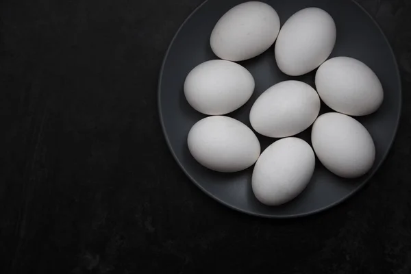 Chicken eggs on a plate — Stock Photo, Image