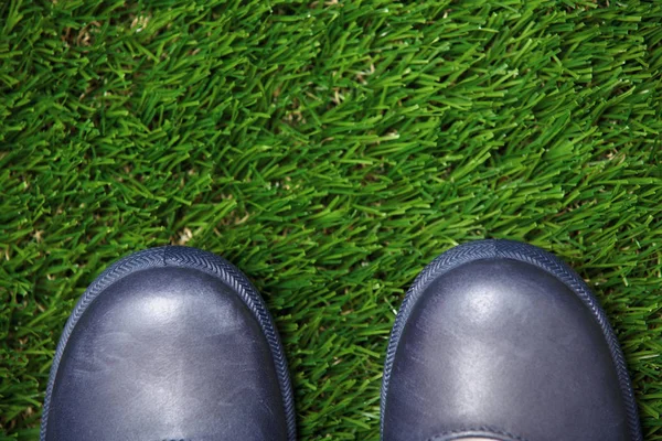 Boots on grass — Stock Photo, Image