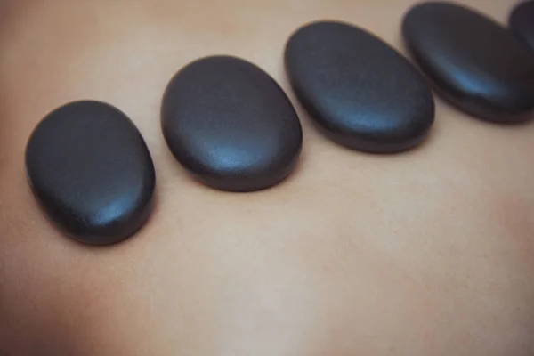 Back of woman laying in spa center — Stock Photo, Image