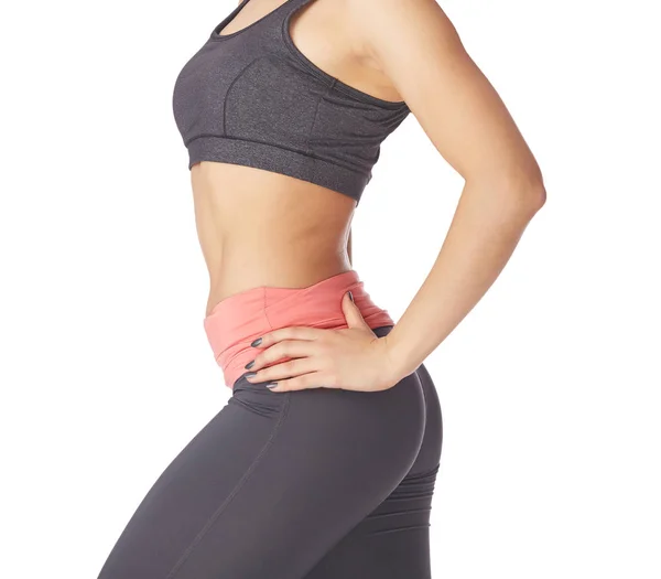 Fitness vrouw in sport kleding op een witte achtergrond — Stockfoto