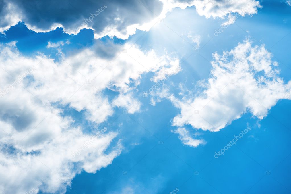 White fluffy clouds on the blue sky