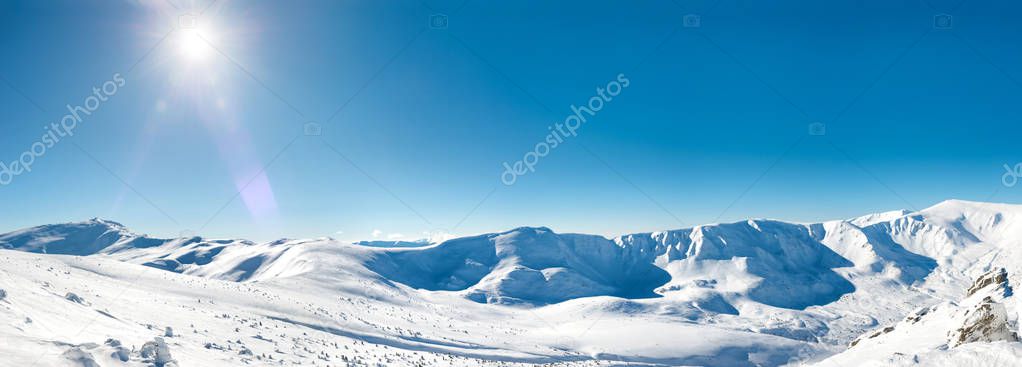 Panorama of white winter mountains