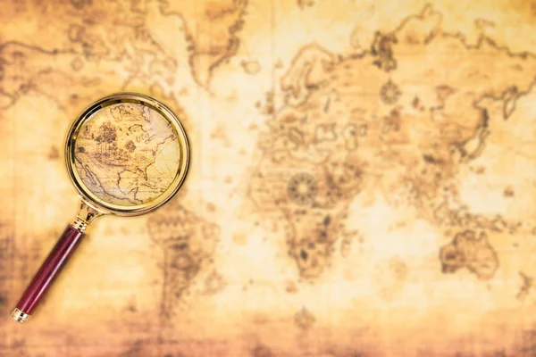Old map with an magnifying glass — Stock Photo, Image